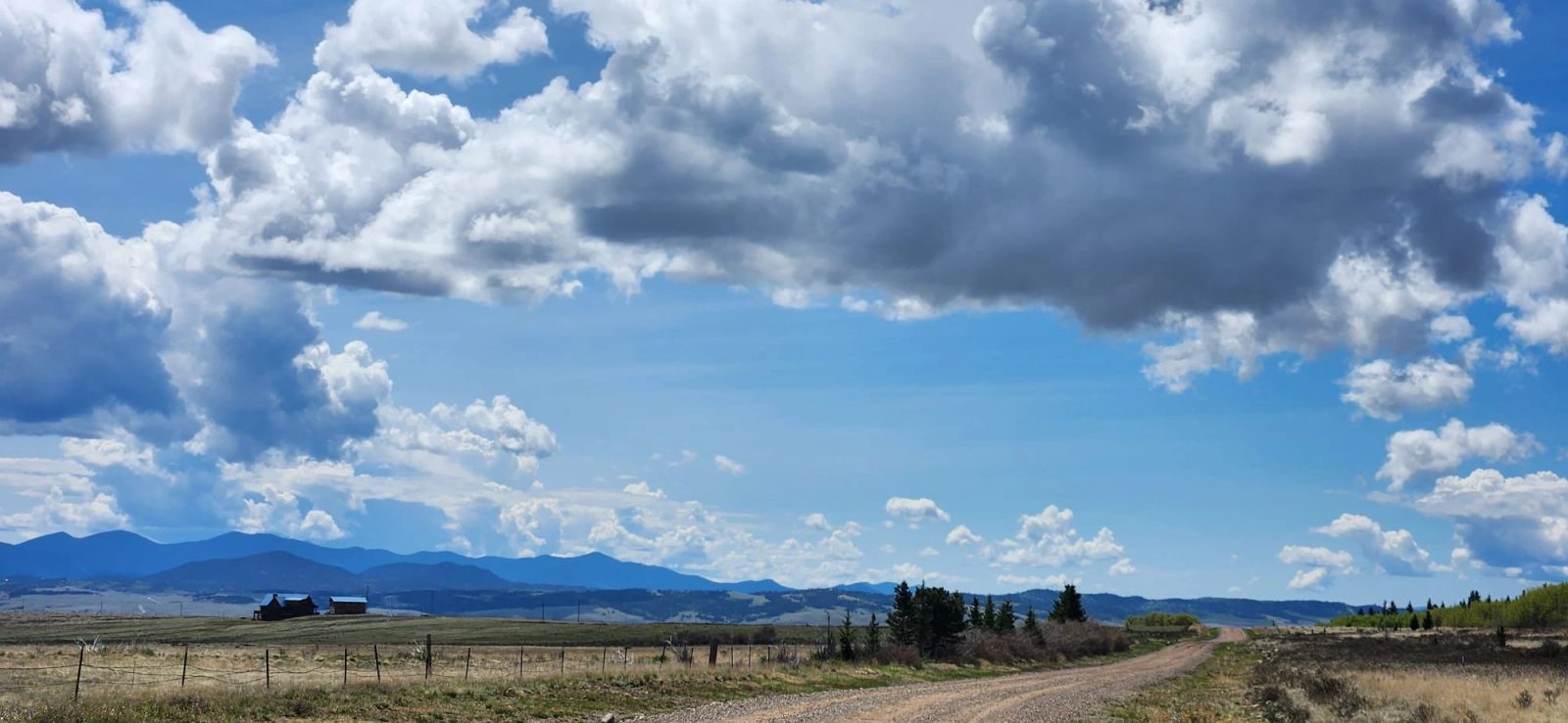 Open mountain road under big skies in Summit County, Colorado, between Frisco and Breckenridge
